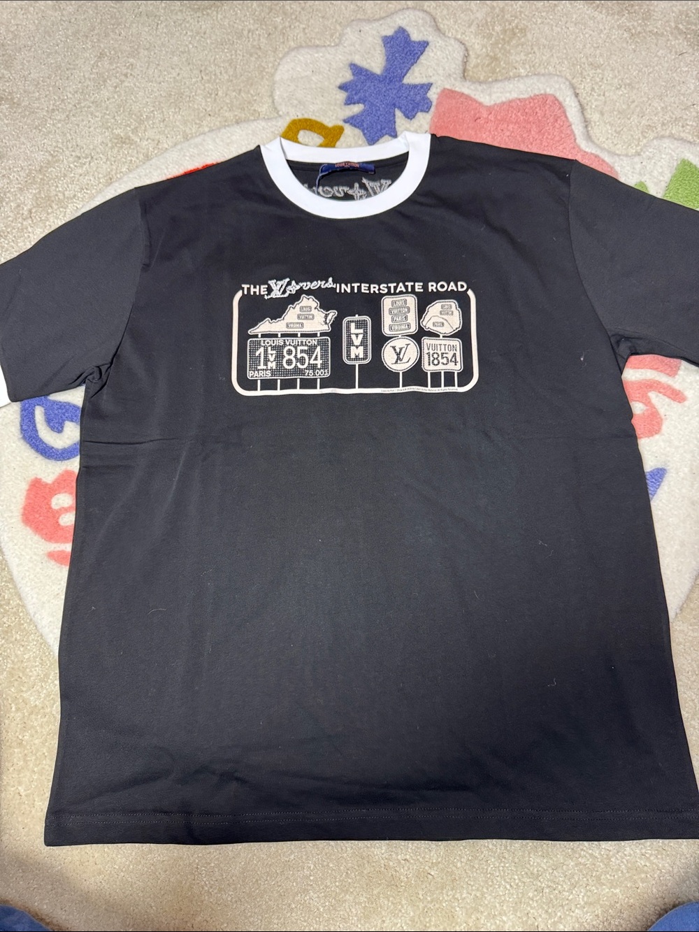 Louis Vuitton Black Tee with White Crew Collar and Cream Graphic